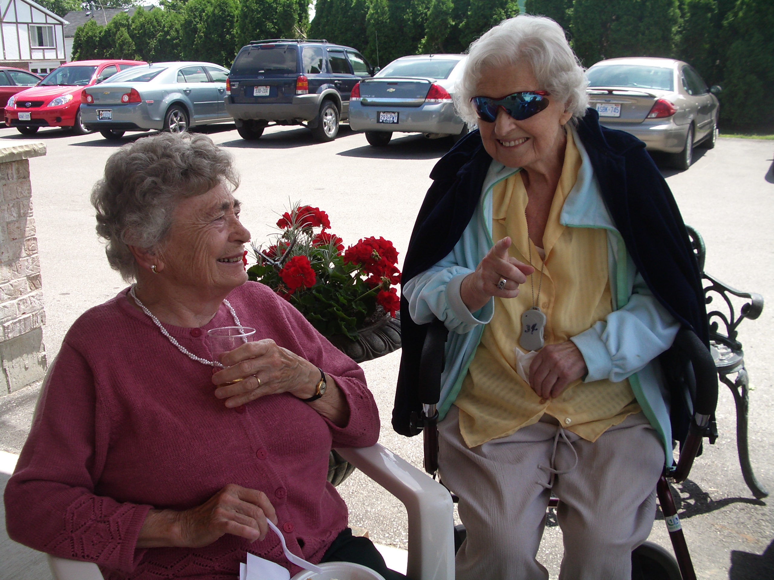 Our Oma, Anne Cepek (pictured right), visiting with her friend at the Strawberry Social event.